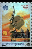 Viaggio in Tunisia 14 aprile 1996. Sullo sfondo un tramonto infuocato fa da cornice alla Cattedrale di Tunisi, dedicata ai SS. Vincenzo d Paoli e Oliva, Patrona di Tunisi, e al minareto di una Moschea della citt. In alto, le chiavi decussate sormontate dal triregno, i nomi del paese visitato e le date del viaggio; in basso, la scritta Citt del Vaticano ed il valore. Policromo.