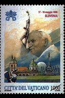 Viaggio in Slovenia 17 - 19 maggio 1996. Sullo sfondo si staglia la Cattedrale di Ljubljana, dedicata a S. Nicola, con in primo piano un drago, simbolo della citt; sulla destra, il monumento dedicato alla Madonna della citt di Maribor. In alto, le chiavi decussate sormontate dal triregno, il nome della sede visitata e le date del viaggio; in basso, la scritta Citt del Vaticano ed il valore. Policromo.